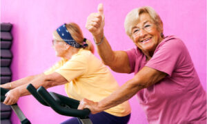 healthy seniors enjoying exercise bike
