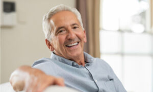 senior wearing flexible dentures